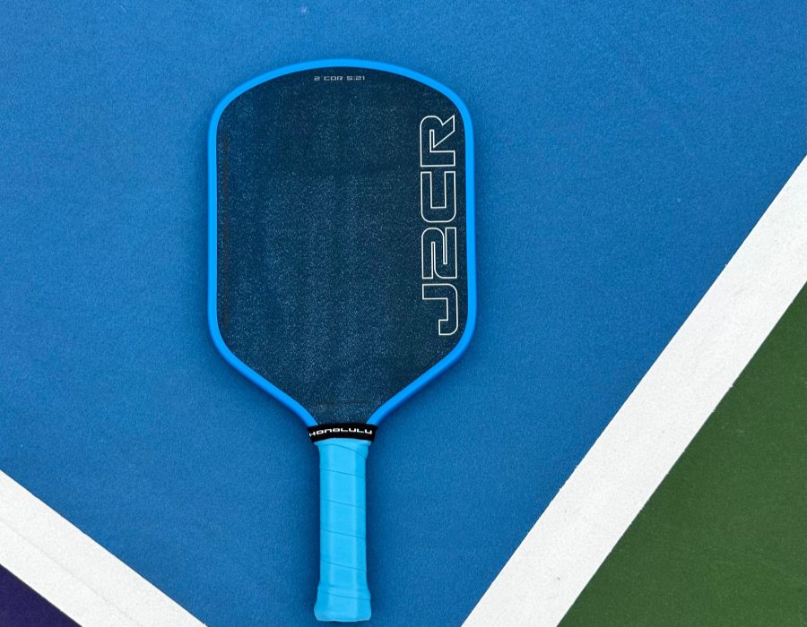 Honolulu J2CR pickleball paddle on a court, Crystal Blue Endurance grit
